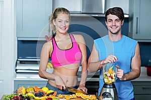 Healthy couple preparing a smoothie