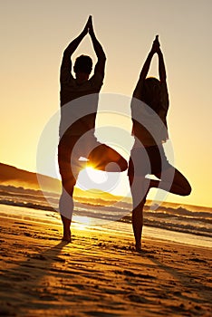 Healthy couple, silhouette and yoga on beach for fitness, meditation and sunset in summer for holiday. Man, woman and