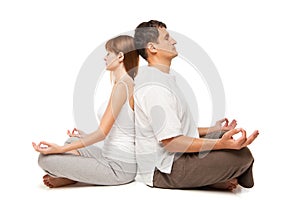 Healthy couple in yoga position on white