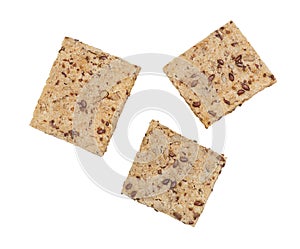 Healthy crackers with chia and flax seeds on white background