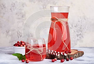 Healthy cranberry juice drink and fresh cranberries. Traditional Russian beverage mors