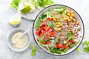 Healthy and delicious bowl with buckwheat and salad of chickpea, fresh pepper and lettuce leaves. Dietary balanced plant-based foo