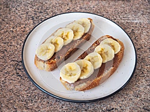 Healthy and delicious snack sandwiches with peanut butter and banana slices