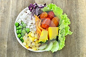 healthy and diet food , fresh vegetable salad lettuce, tomato, pumpkin, carrot, corn, millet, cucumber, purple cabbage