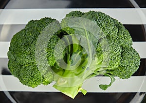 Healthy diet. diet food. green, raw broccoli on a plate. healthy diet. green cabbage close-up. HLS. eating raw photo