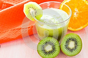 Healthy diet fruit juice kiwi orange wooden table
