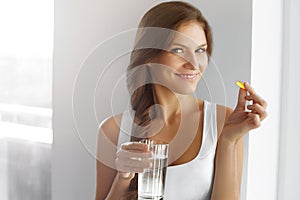 Healthy Diet. Nutrition. Vitamins. Healthy Eating, Lifestyle. Woman With Fish Oil Capsules.