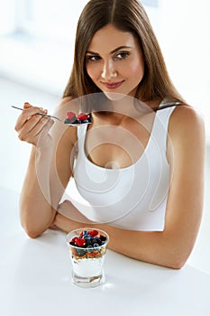 Healthy Diet Nutrition. Woman Eating Yogurt, Berries And Cereal