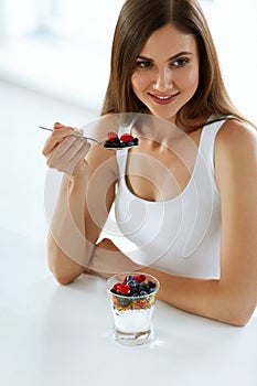 Healthy Diet Nutrition. Woman Eating Yogurt, Berries And Cereal