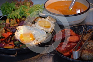 Healthy diet - stewed veggies and fried eggs nicely arranged on a table