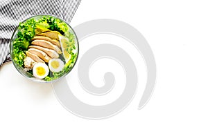 Healthy dinner in bowl on white background top view copyspace
