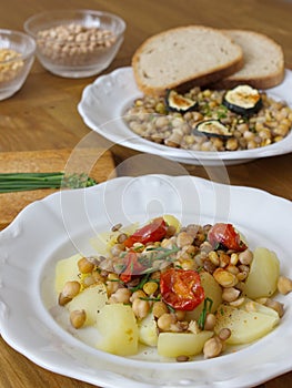 Healthy dinner consist of legumes and vegetable, served with bread