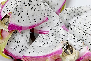 Healthy dragon fruit or pitaya pieces background, close up of beautiful fresh sliced dragon fruit with texture in the market in