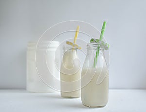 Healthy drink, gourmet drink, smoothie, kefir with  and protein, milk with , white drink in clear bottles, cock