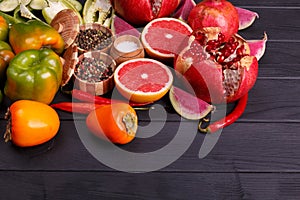 Healthy eating background studio photography of different fruits and vegetables on old wooden table