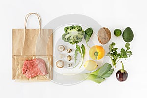 Healthy eating background top view Full paper bag healthy food