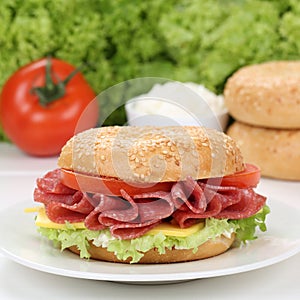 Healthy eating bagel for breakfast with salami ham