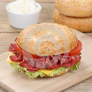 Healthy eating bagel sandwich for breakfast with salami ham