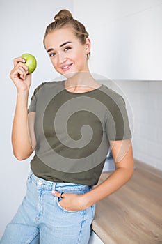 Healthy Eating Concept. Diet. Beautiful young woman in the kitchen with healthy food