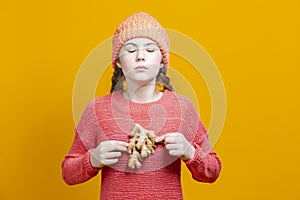 Healthy Eating Concepts. Thinking Caucasian Girl In Coral Knitted Clothing Posing With Cauliflower as a Demonstration of Human