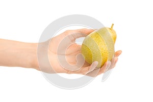 Healthy eating and diet Topic: Human hand holding yellow pear isolated on a white background in the studio