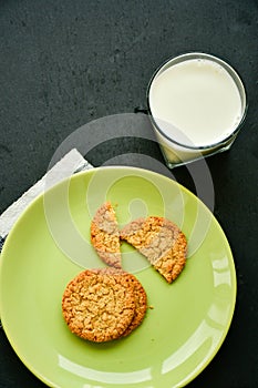 Oatflakes cookies and glass of milk photo