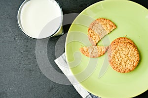 Oatflakes cookies and glass of milk photo