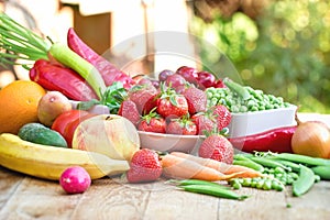 Healthy organic food on table otdoor, fresh organic fruit and ve getable - healthy eating photo