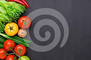 Healthy eating ingredients: fresh vegetables, fruits and superfood. Concrete background