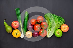 Healthy eating ingredients: fresh vegetables, fruits and superfood. Concrete background