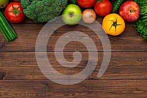 Healthy eating ingredients: fresh vegetables, fruits and superfood. Wooden background