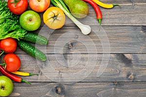 Healthy eating ingredients: fresh vegetables, fruits and superfood. Wooden background