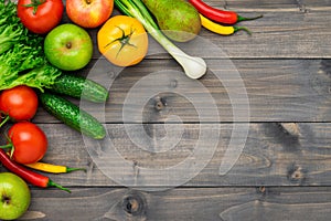 Healthy eating ingredients: fresh vegetables, fruits and superfood. Wooden background