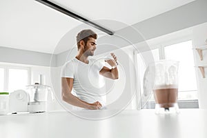 Healthy Eating. Muscular Man Drinking Sports Shake Drink Indoors