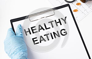 Healthy eating text on tabl. Medical