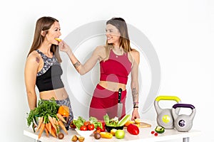 Healthy Eating Women Cooking Salad. Beautiful Smiling Vegan Girls Going To Eat Fresh Green Organic Vegetables. 