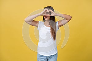 Healthy Eyes And Vision. Portrait Of Beautiful Happy Woman Holding Heart Shaped Hands Near Eyes. Closeup Of Smiling Girl