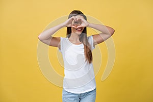 Healthy Eyes And Vision. Portrait Of Beautiful Happy Woman Holding Heart Shaped Hands Near Eyes. Closeup Of Smiling Girl