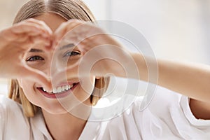 Healthy Eyes And Vision. Woman Holding Heart Shaped Hands Near Eyes