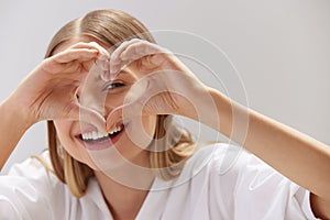 Healthy Eyes And Vision. Woman Holding Heart Shaped Hands Near Eyes