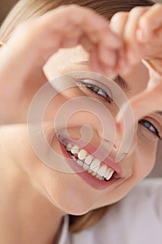Healthy Eyes And Vision. Woman Holding Heart Shaped Hands Near Eyes photo