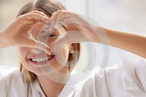 Healthy Eyes And Vision. Woman Holding Heart Shaped Hands Near Eyes photo