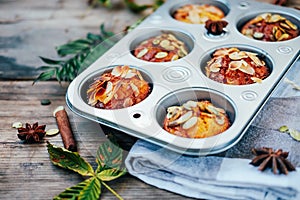 Healthy fall vegetarian dessert. Apple cupcake with pumpkin, almond seeds