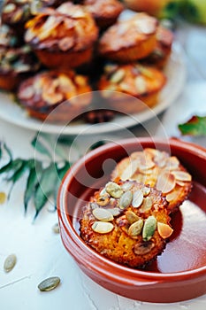 Healthy fall vegetarian dessert. Apple cupcake with pumpkin, almond seeds