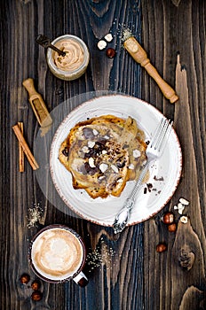 Healthy fall and winter breakfast. Vegan vanilla french toast with caramelized bananas, raw dark chocolate and hazelnut butter