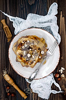 Healthy fall and winter breakfast. Vegan vanilla french toast with caramelized bananas, raw dark chocolate and hazelnut butter