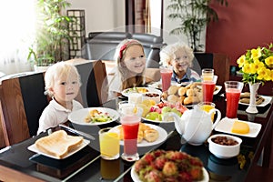 Healthy family breakfast for mother and kids.