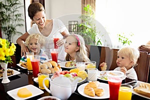 Healthy family breakfast for mother and kids.