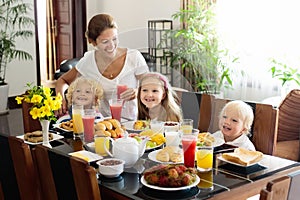 Healthy family breakfast for mother and kids.