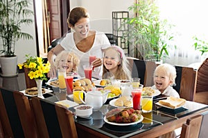 Healthy family breakfast for mother and kids.